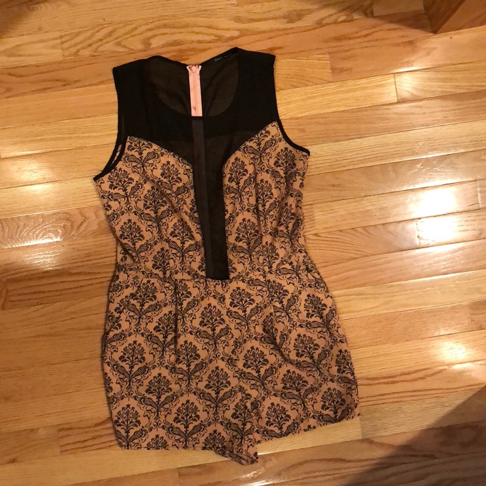 Salmon and black mesh romper.